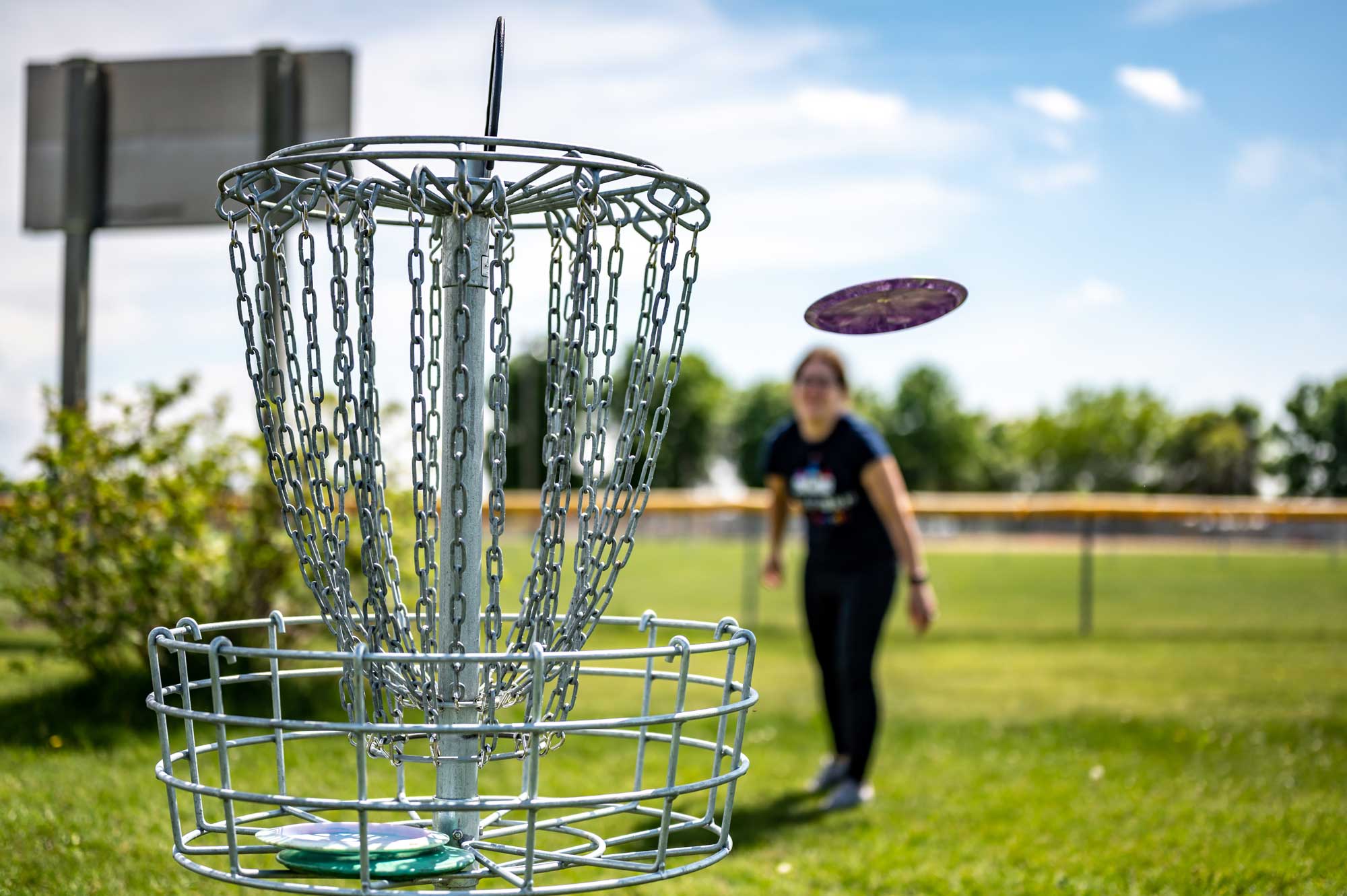 Disc Golf woman throwing disc